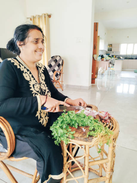 istock Indian woman preparing food 2162278613