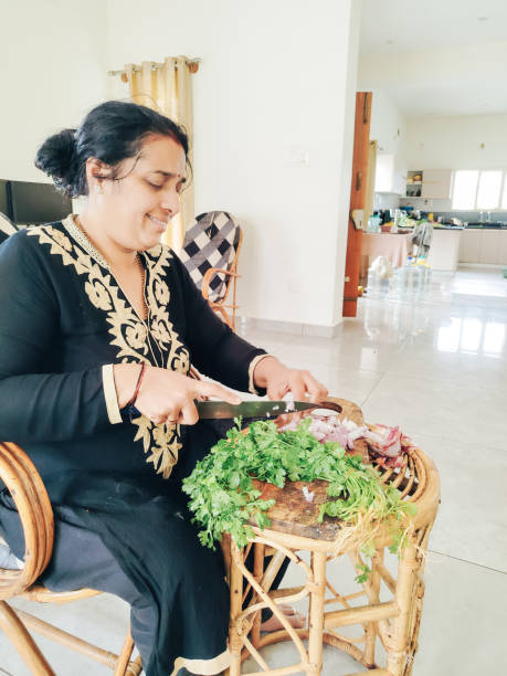 istock Indian woman preparing food 2162279526