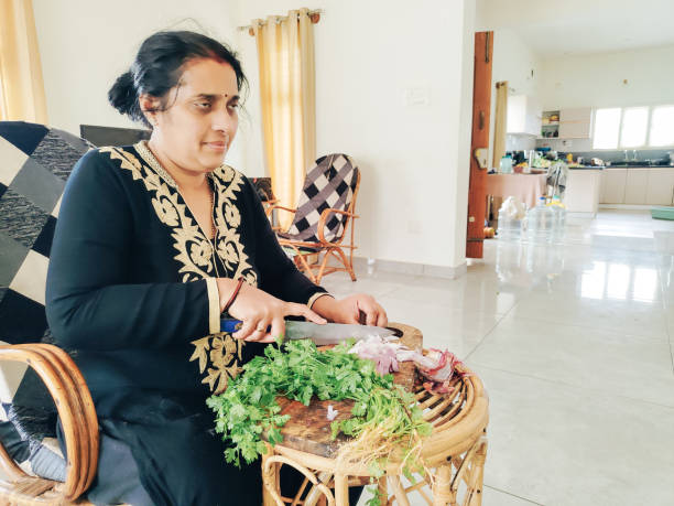 istock Indian woman preparing food 2162279910