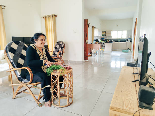 istock Indian woman preparing food 2162280074