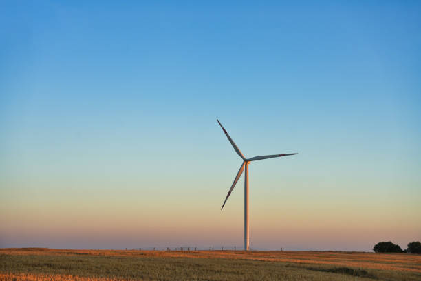 istock Solitary Wind Turbine at Sunset 2162289638