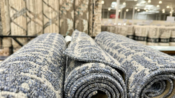istock a close-up of rolled carpets with intricate patterns displayed in a store 2162293333