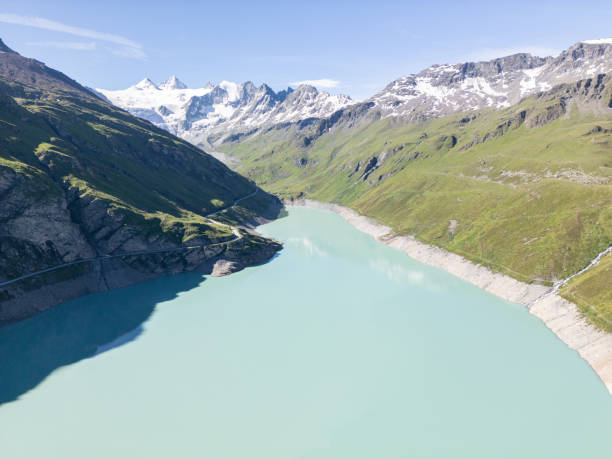 istock Turquoise Alpine Lake with Snow-Capped Mountains 2162295694