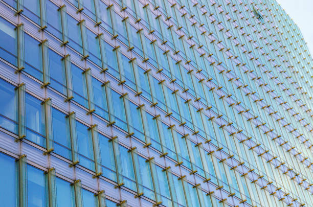 istock Charlemagne building wall modernism architecture style, modern high-rise office building, abstract details of facade glass curtain wall, patterned glass cells, Brussels city, Belgium 2162300591