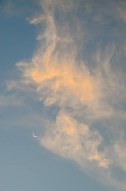 istock A large cloud with a crescent moon in the sky 2162302706