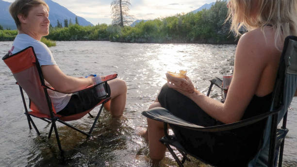 istock Friends relax in river together 2162303629