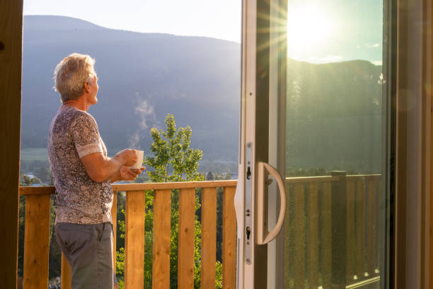 istock Senior man looks at mountains from verandah 2162303803
