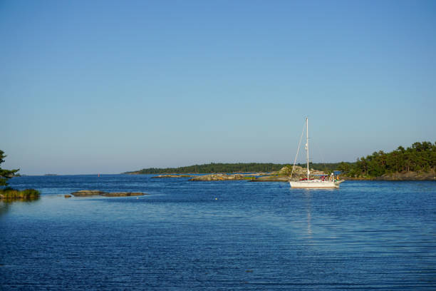 A sailboat among islands of the Stockholm archipelago in Värmdö municipality, Sweden.