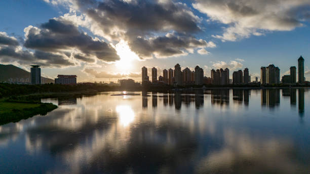 Lakeside city and cloud reflections at sunrise