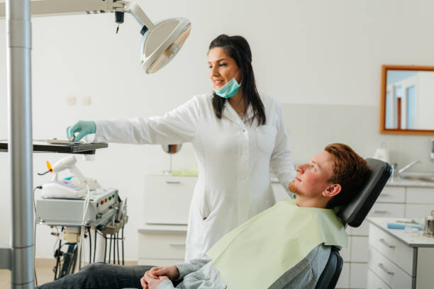 istock Professional dentist at work with her patient 2162305887