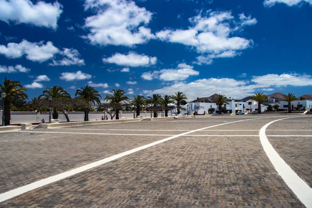 Square with exotic palm trees in Lanzarote, Spain