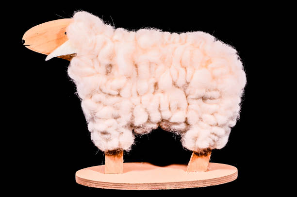 White Sheep plastic toy on blue background