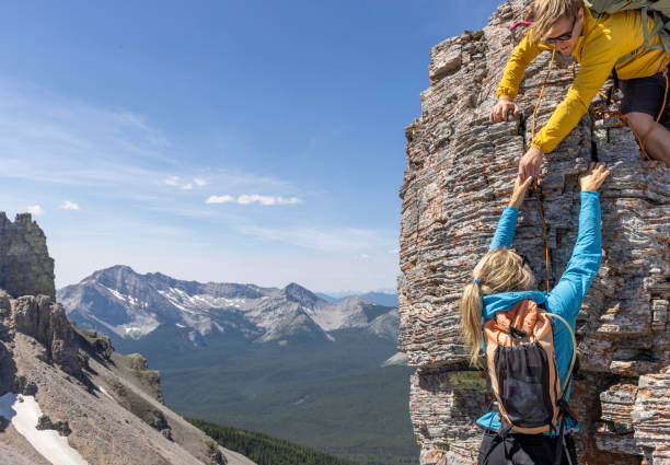 Climber offers helping hand to friend