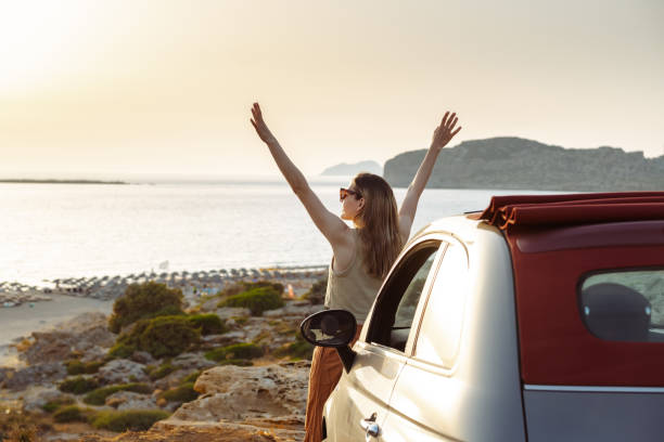 istock Summertime road trip. Young woman enjoying view 2162312913