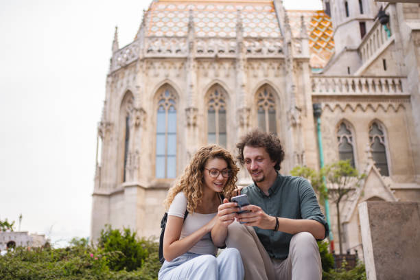 istock Tourists enjoy a moment together while exploring the Buda Castle area in Budapest during a sunny afternoon 2162313381
