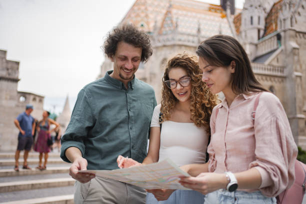 istock Friends exploring Budapest with a map on a sunny day 2162313434