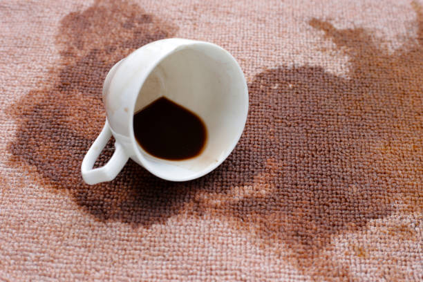 istock Coffee spilled from white cup on the carpet 2162313548