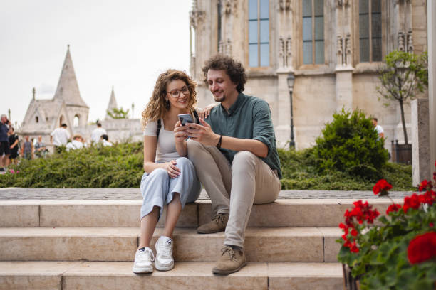 istock Couple enjoying time together in Budapest while looking at a smartphone 2162313599