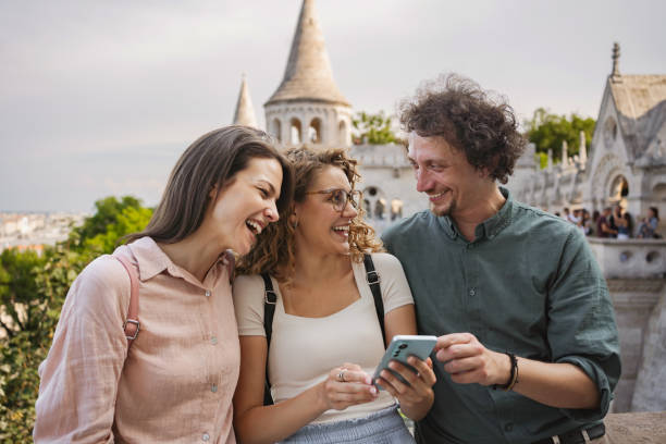 istock Friends enjoying a sunny day while exploring the historic architecture of Budapest 2162313690