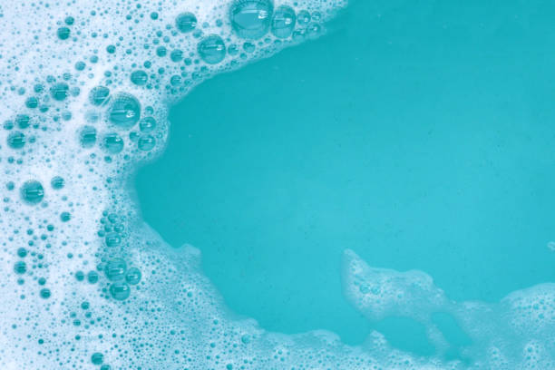 istock Detergent foam bubble on water. Blue background, Soap sud 2162314267