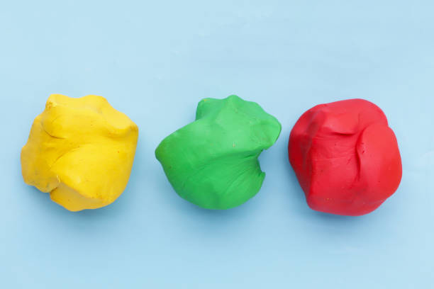 istock Colorful plasticine clay on blue background. 2162314328