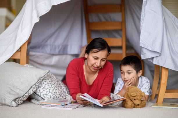 istock Mother and son lounge at home and read a book 2162319391