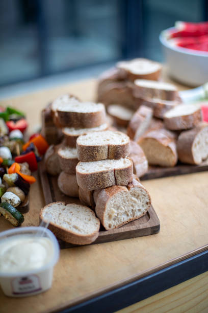 istock Freshly sliced bread on a wooden board 2162319406