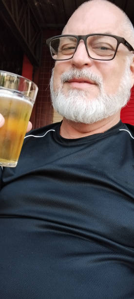 istock man drinking beer alcoholic addiction happy hours 2162320116