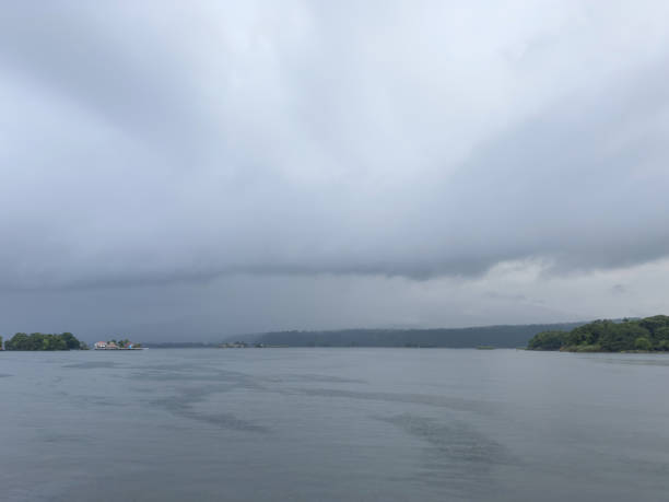 Stormy weather nature background. Lake with rain clouds