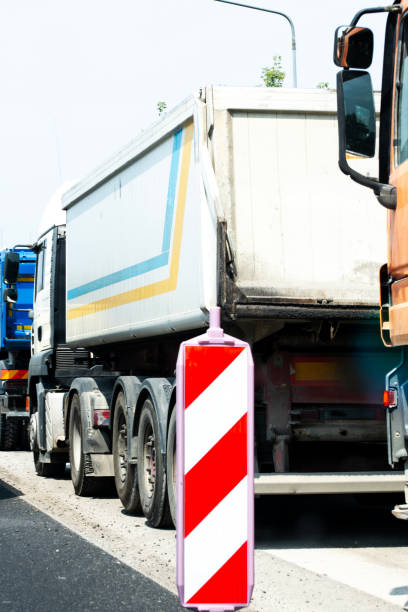 istock Trucks waiting in traffic jam 2162322378