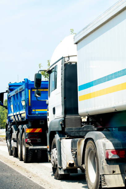 istock Trucks waiting in traffic jam 2162322406