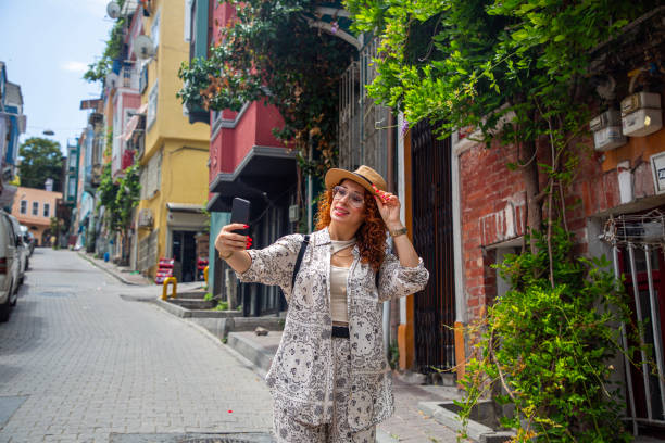 istock Young tourists walking and taking photos at Balat 2162324985