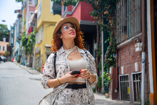 istock Young tourists walking and taking photos at Balat 2162324986