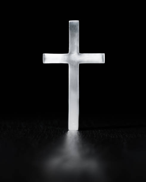 istock Shiny cross, simple Christian religious symbol, glowing brightly with reflection. 2162326401