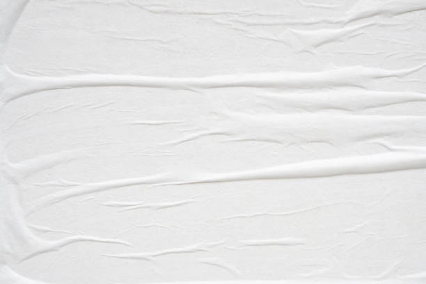 istock White blank crumpled and creased paper poster texture background 2162328504