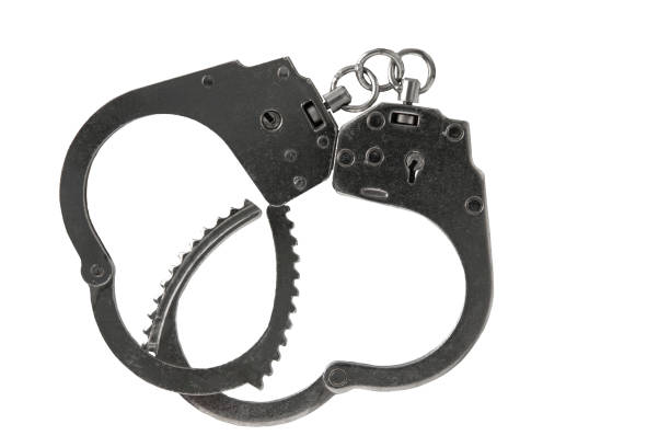 istock Unfastened silver handcuffs, isolated on a white background 2162329187
