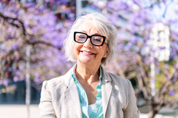 istock lively mature woman smiling looking at camera 2162329321
