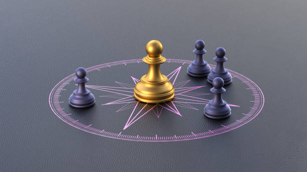 istock Golden Chess Pawn on Compass with Black Background - This image symbolizes strategic leadership, guiding the direction of the team. 3D rendering. 2162329878