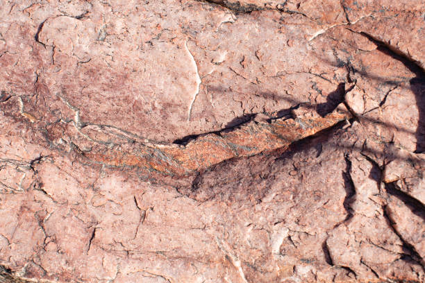 istock Pink rock with small veins of quartz 2162330276