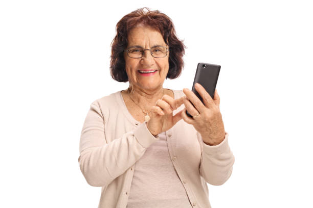 istock Elderly woman typing on a phone and smiling 2162334485