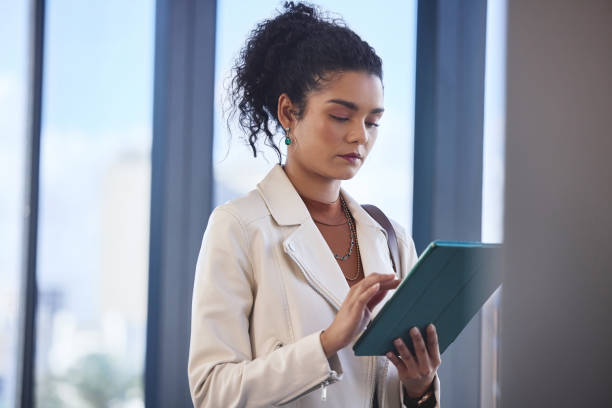 istock Tablet, research and woman in office for creative career development for journalism article. Digital technology, reading and female copywriter with online email for publishing client in workplace. 2162337430