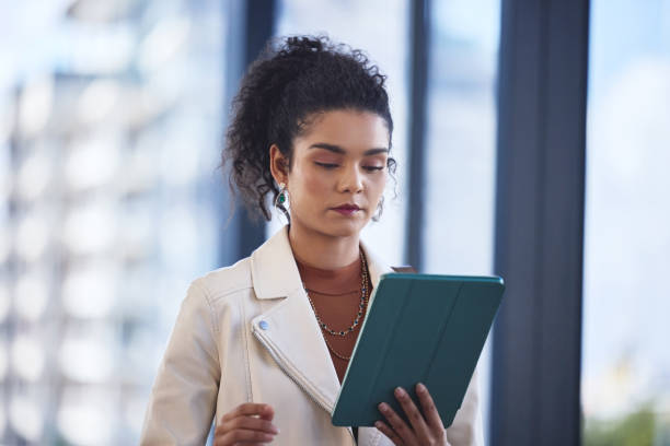 istock Tablet, reading and woman in office for creative career development for journalism article. Digital technology, research and female copywriter with online email for publishing client in workplace. 2162337435