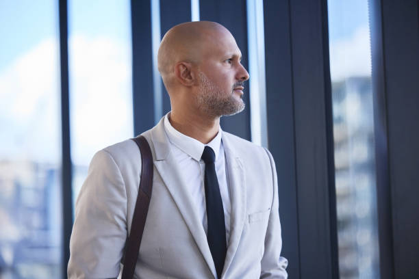 istock Consultant, thinking and man with ideas in modern office, financial advisor and problem solving. Person, business owner and employee with decision, opportunity and confidence with career ambition 2162337453