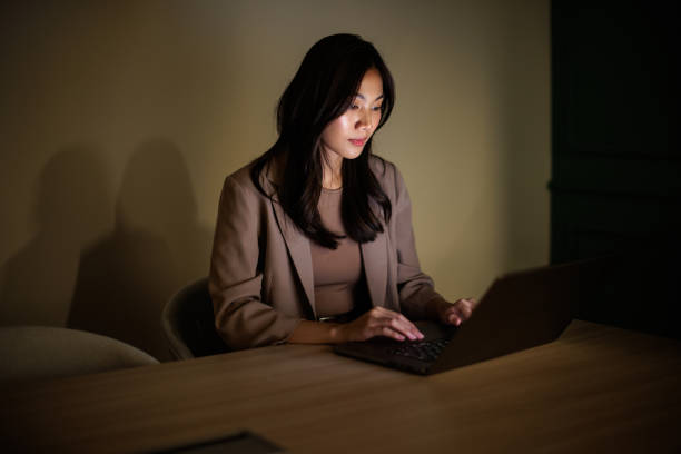 istock Businesswoman working late 2162340132