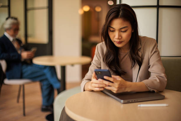 istock Businesswoman Using Smart Phone 2162340378