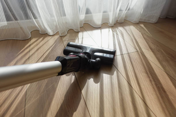 istock cleaning floor dust with vacuum cleaner. 2162341278