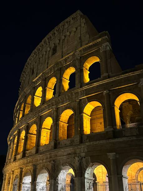 The Roman Colosseum illuminated on a Fall night
