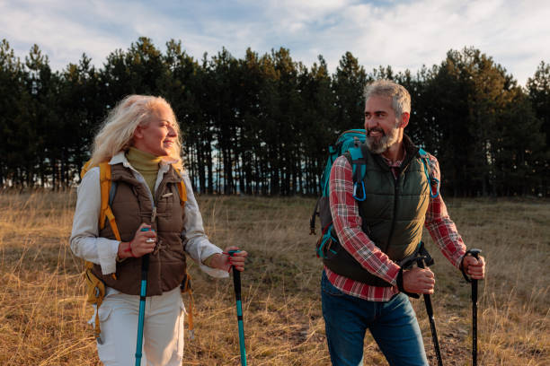 istock Happy senior couple walking in mountains 2162347538