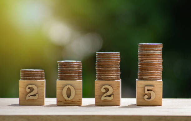 istock stack of coins on top 2025 number on wood block. 2162347731
