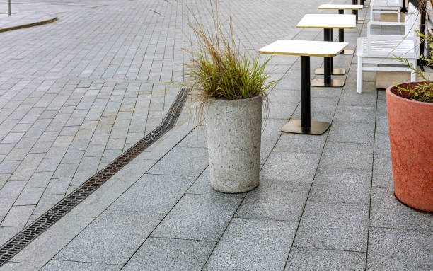 istock empty outdoor cafe with tables and chairs at early morning. 2162350533